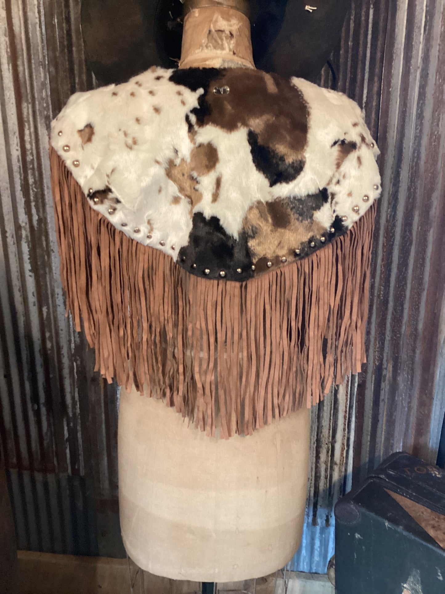 faux cowhide cape with fringe